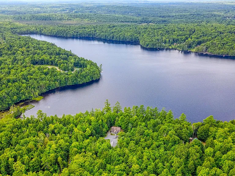 Over 300 Feet of Sandy Pond Frontage on 9.57 Private Acres