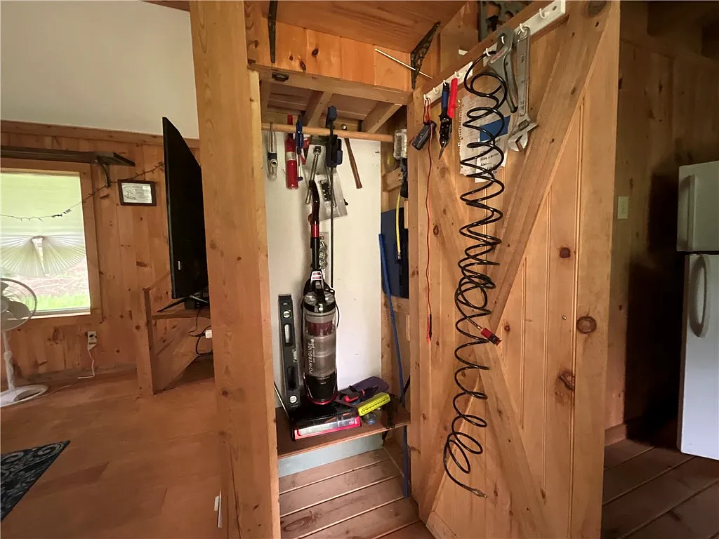An Adirondack-Style Cabin on 300 Feet of a 35-Acre Pond