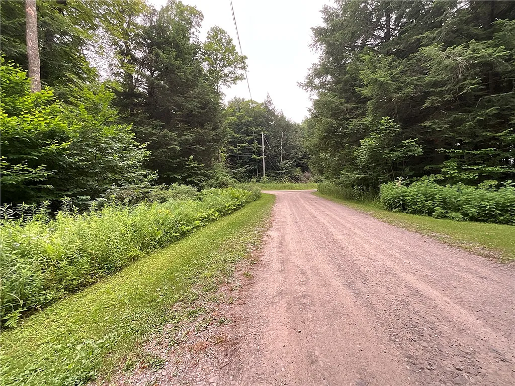 An Adirondack-Style Cabin on 300 Feet of a 35-Acre Pond