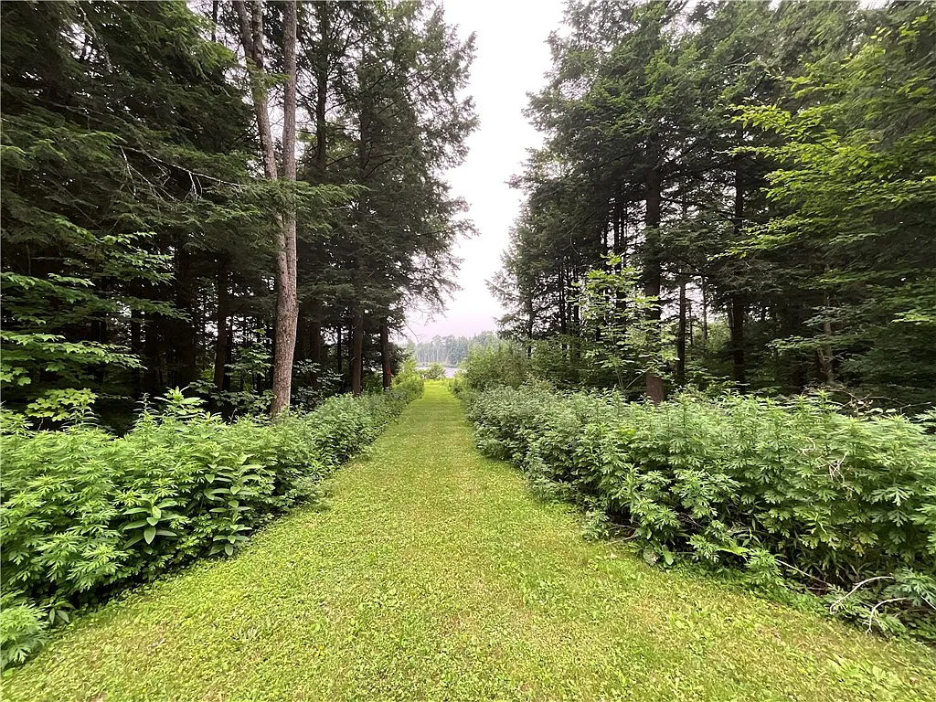 An Adirondack-Style Cabin on 300 Feet of a 35-Acre Pond