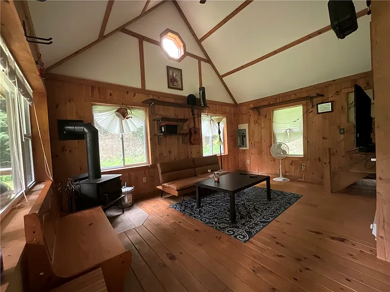 An Adirondack-Style Cabin on 300 Feet of a 35-Acre Pond