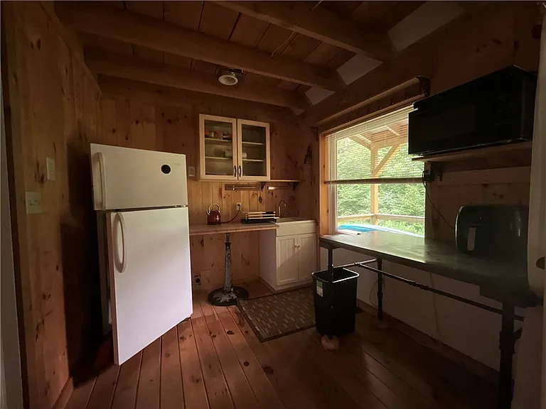 An Adirondack-Style Cabin on 300 Feet of a 35-Acre Pond