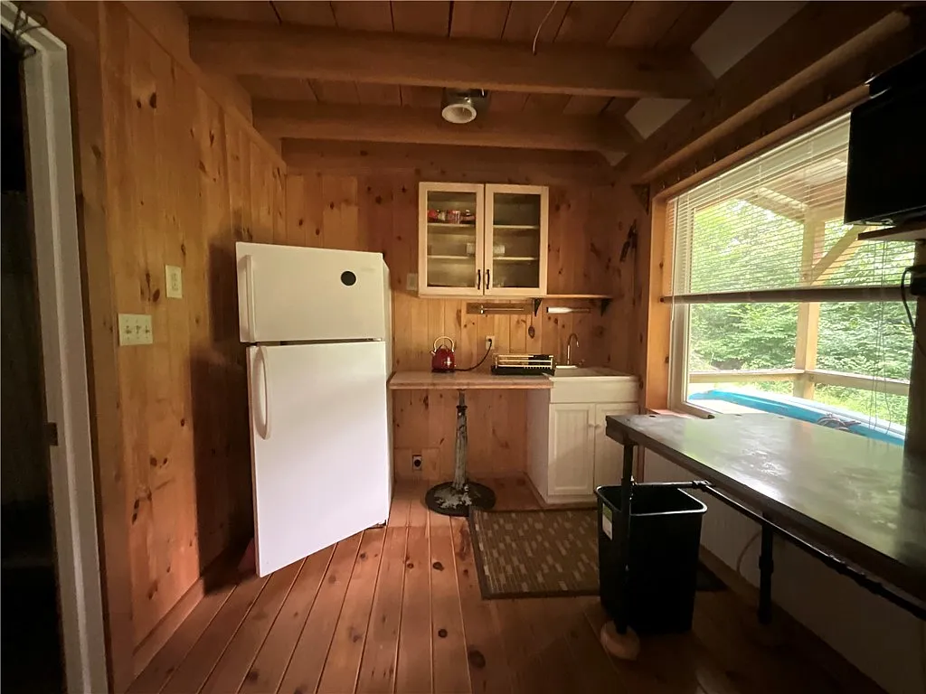 An Adirondack-Style Cabin on 300 Feet of a 35-Acre Pond