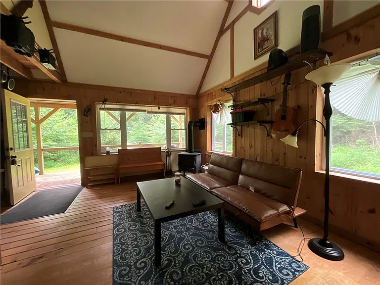 An Adirondack-Style Cabin on 300 Feet of a 35-Acre Pond