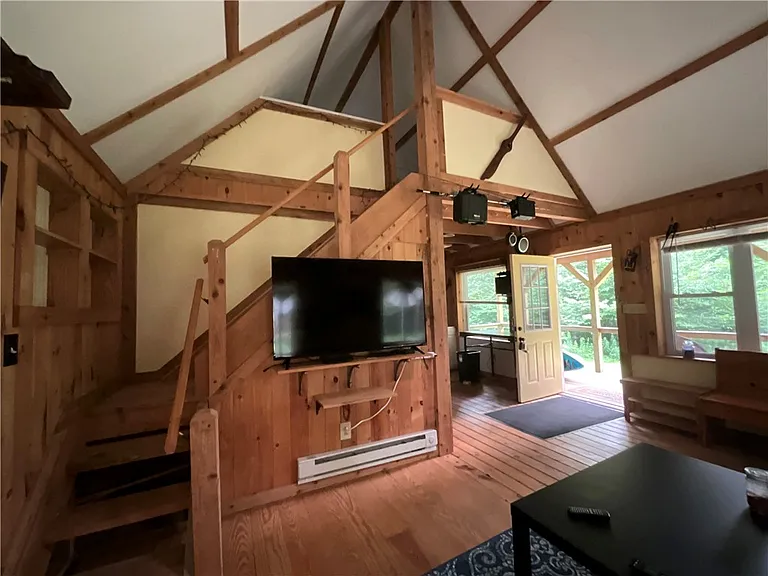 An Adirondack-Style Cabin on 300 Feet of a 35-Acre Pond