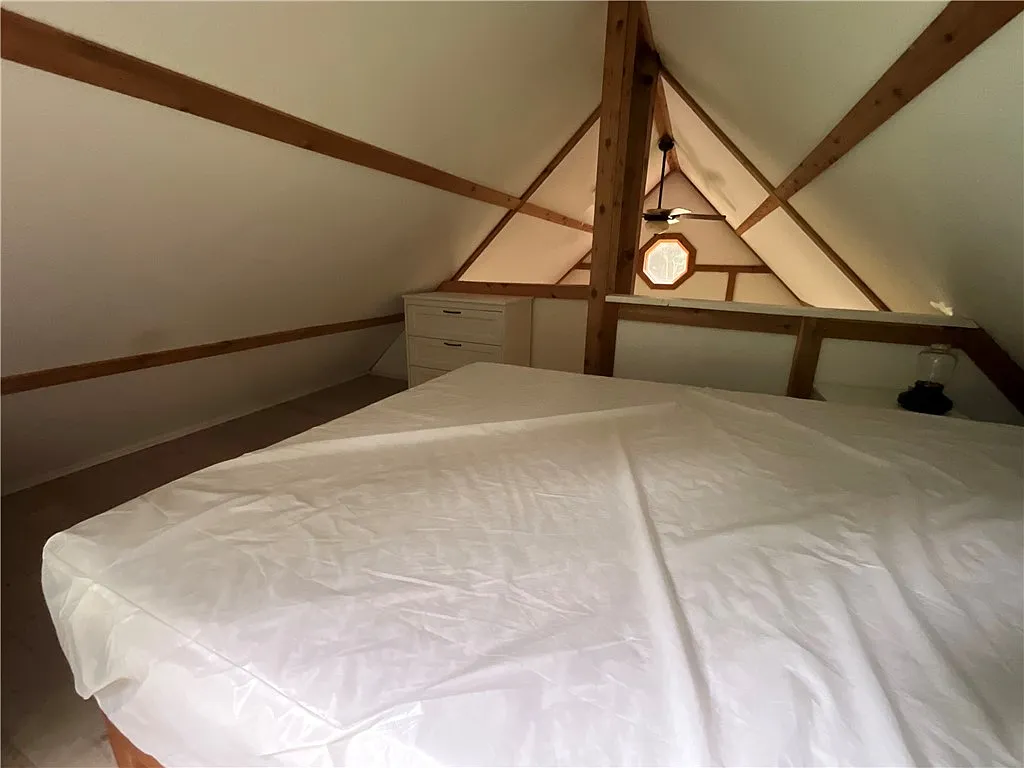 An Adirondack-Style Cabin on 300 Feet of a 35-Acre Pond