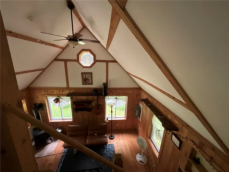 An Adirondack-Style Cabin on 300 Feet of a 35-Acre Pond