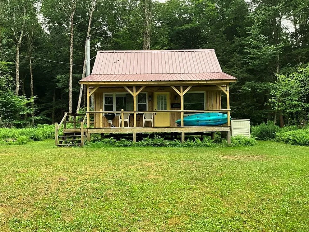 An Adirondack-Style Cabin on 300 Feet of a 35-Acre Pond